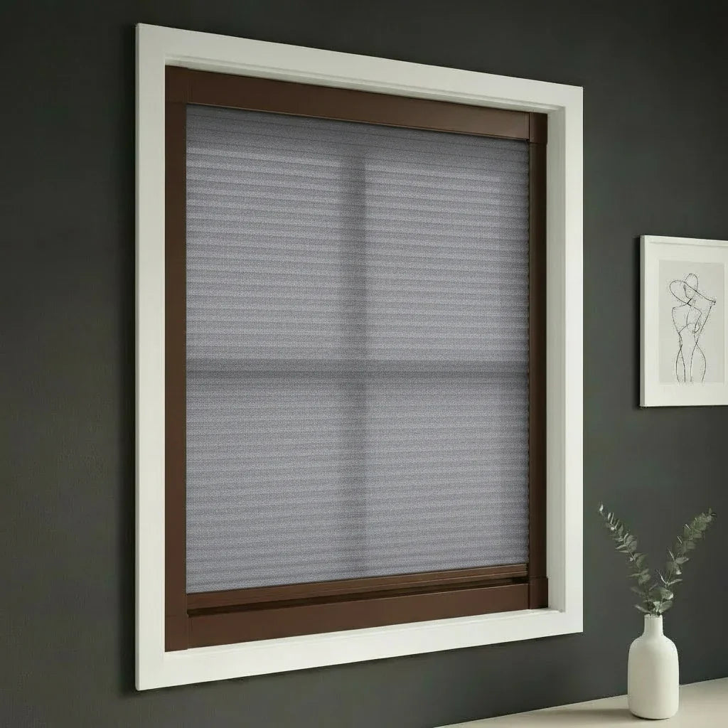 FAIZ light filtering cellular blind in Grey fabric with Coffee Brown rail, shown for comfortable daylight throughout the home.