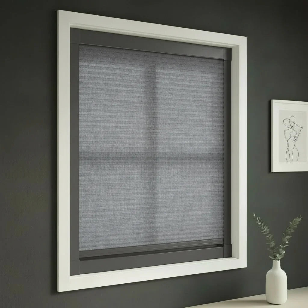 FAIZ light filtering cellular blind in Grey fabric with Dark Grey rail, shown for a clean modern-home window finish.