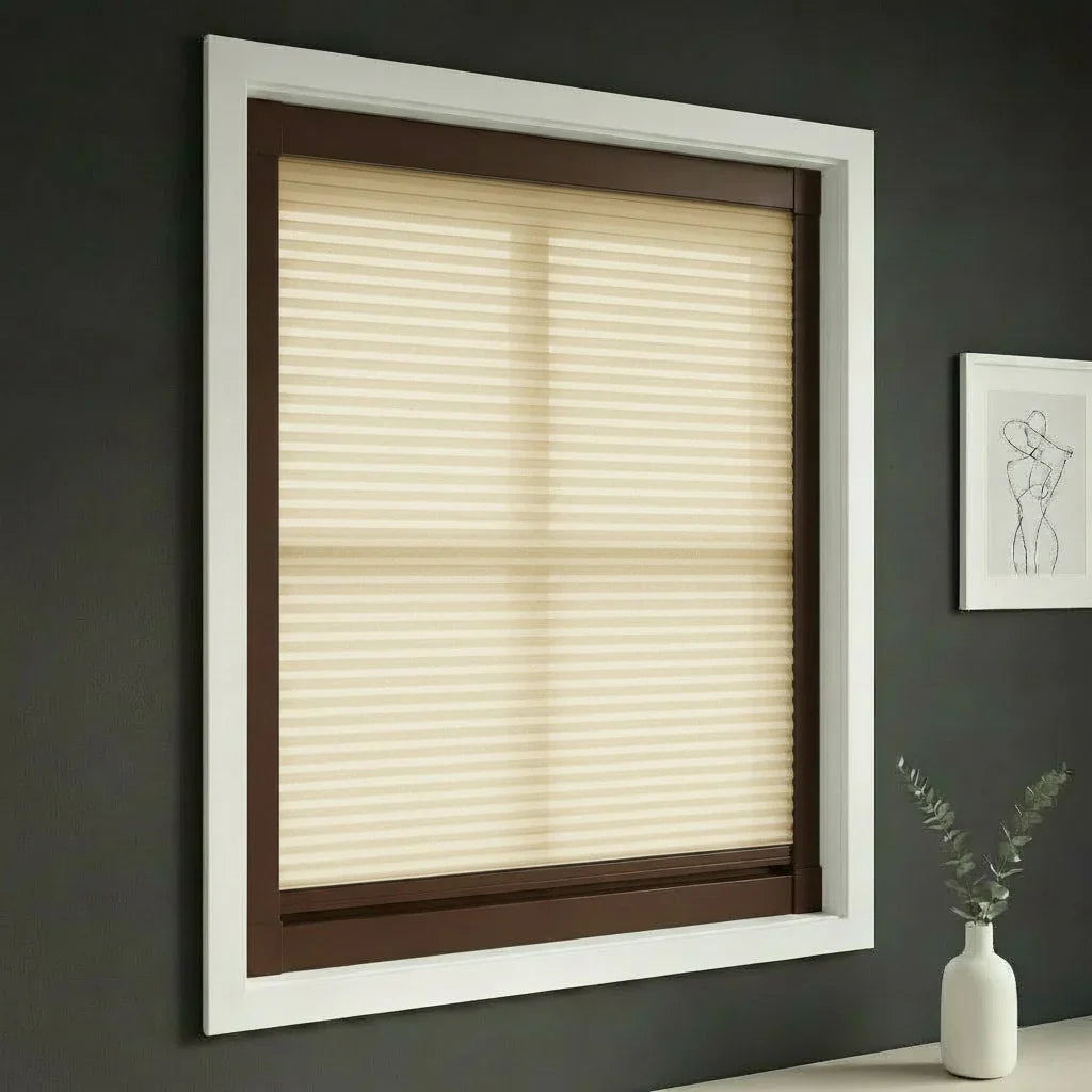 FAIZ light filtering cellular blind in Light Khaki fabric with Coffee Brown rail, shown for comfortable daylight in an energy-conscious home.