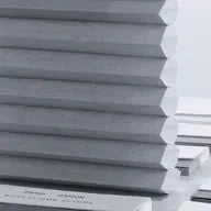 Grey light-filtering honeycomb fabric for balanced room brightness