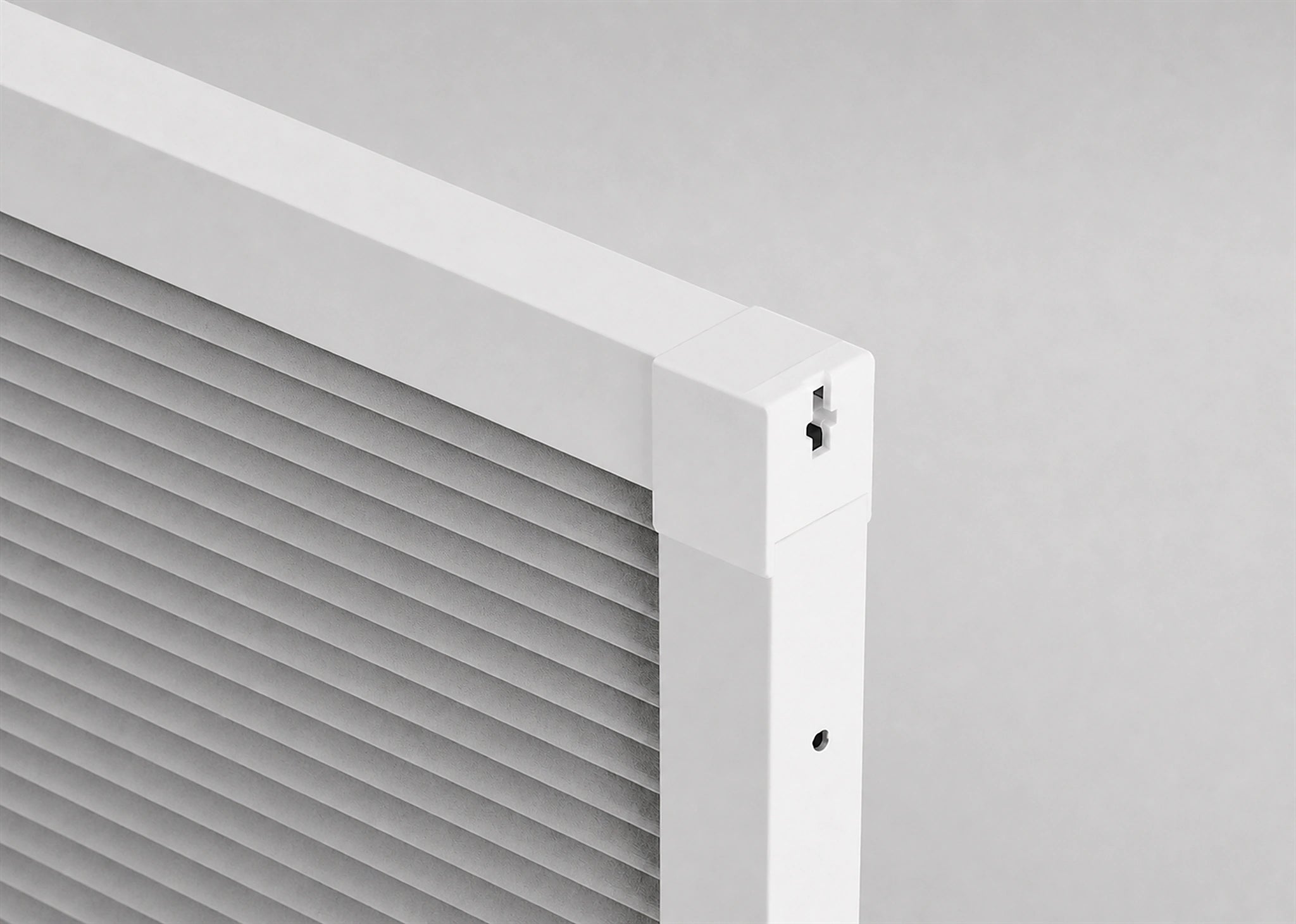 Slim white aluminium rail profile sealing a blackout honeycomb blind for better sleep